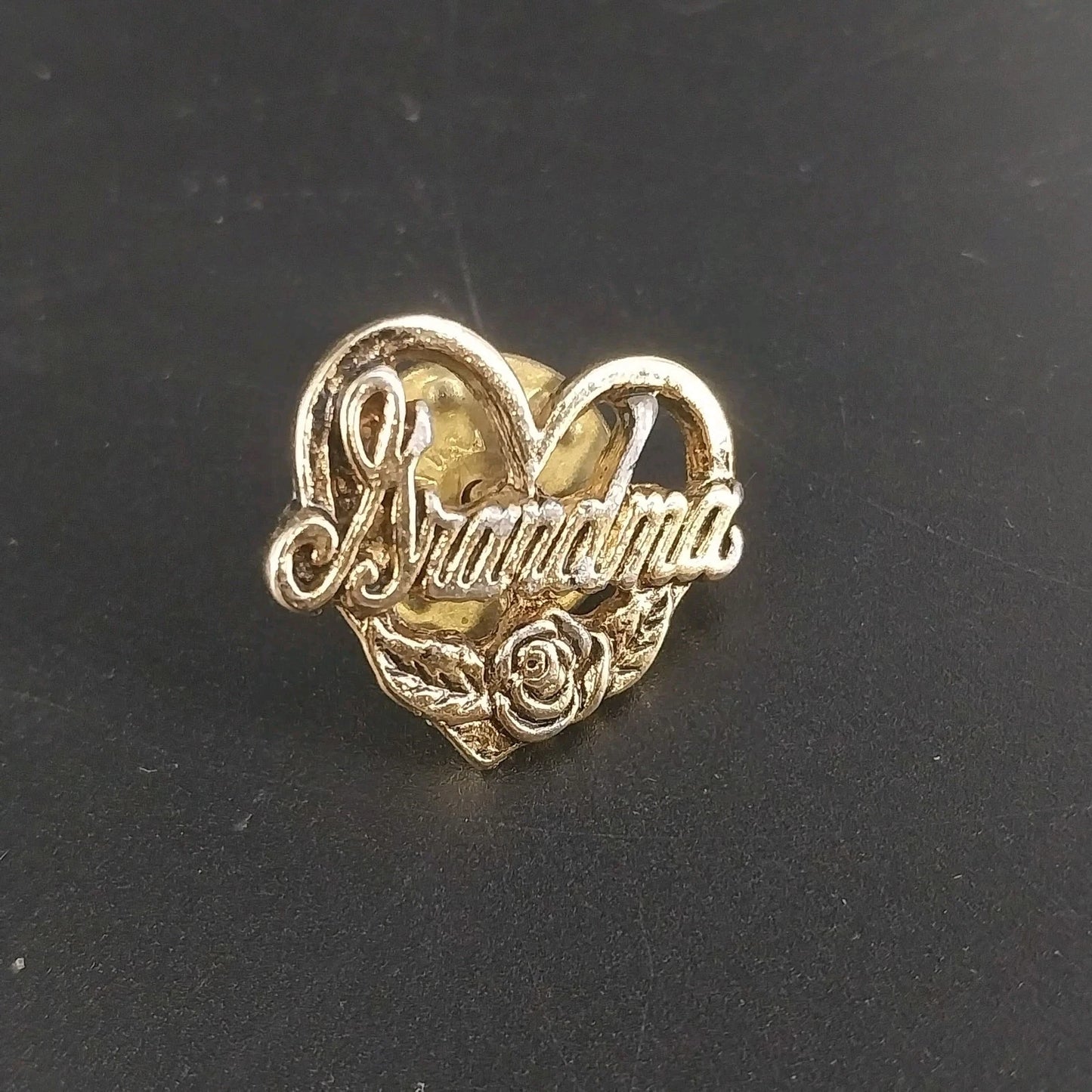 Vintage gold tone Grandma heart brooch with floral rose design