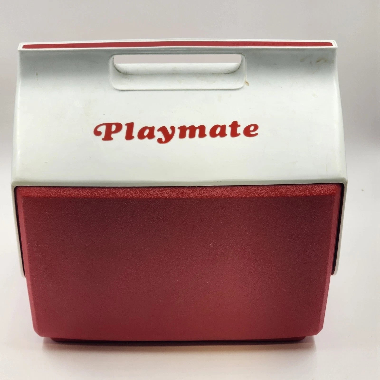 Vintage red and white Igloo Playmate cooler with sliding lid