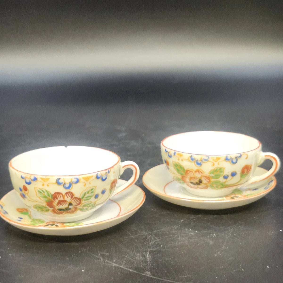 Vintage Japan porcelain demitasse cups and saucers with floral design