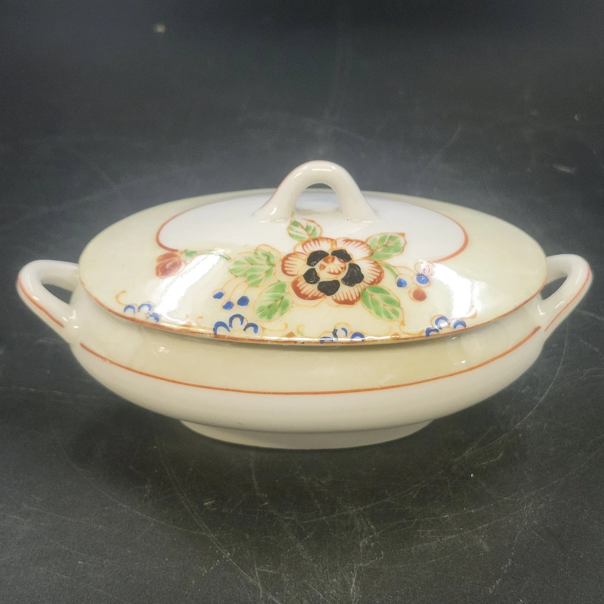 Vintage Japan porcelain covered serving bowl with floral design and double handles