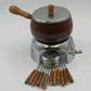 Vintage brown enamel fondue pot set with wood handles and metal stand