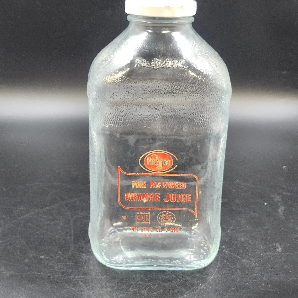 Vintage Kroger 64 oz clear glass orange juice jug with white cap