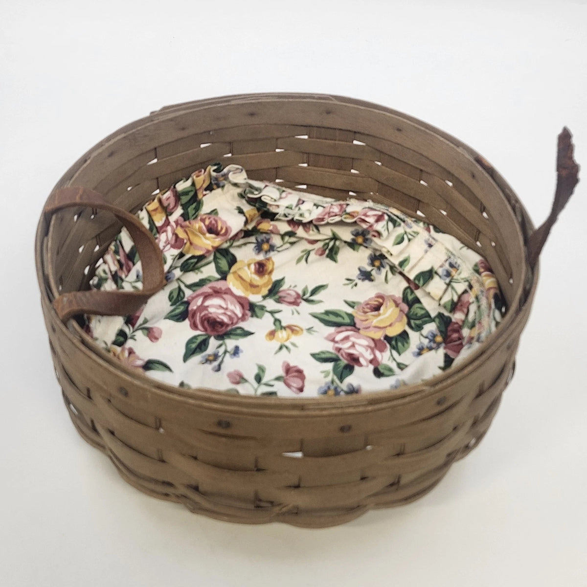Vintage Longaberger 10-inch darning basket with floral liner and leather handles
