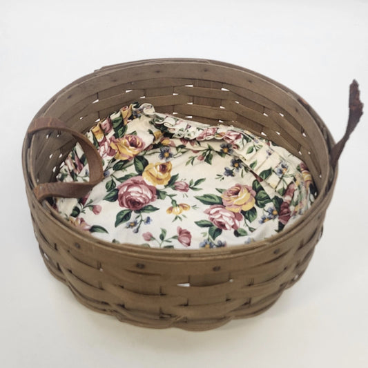 Vintage Longaberger 10-inch darning basket with floral liner and leather handles