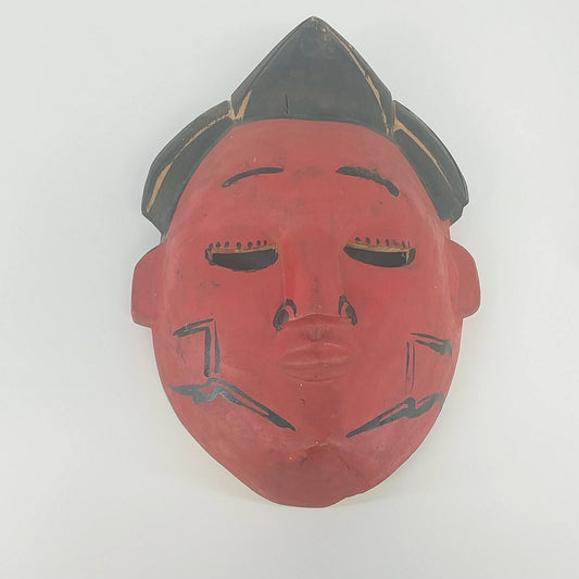 Hand carved Nigerian Gelede mask in red and black painted wood