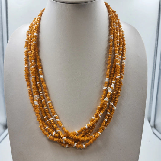 Layered 24-inch necklace with irregular orange and white chip-style beads and gold-tone end caps.