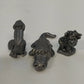 Three vintage pewter animal figurines pelican alligator creature