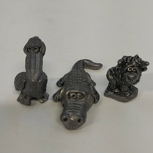 Three vintage pewter animal figurines pelican alligator creature