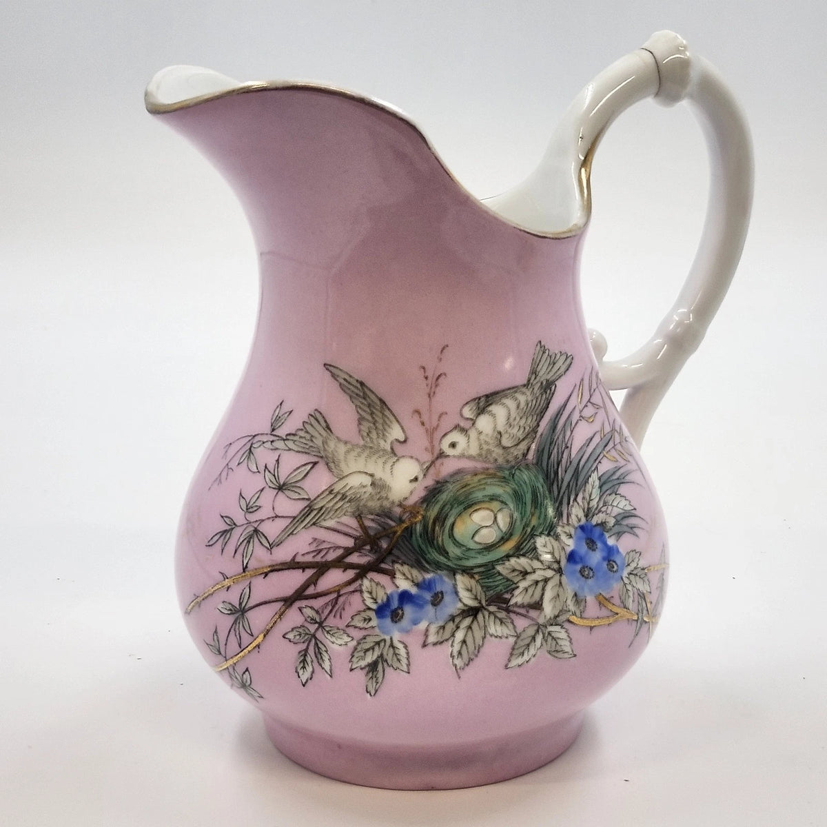 Vintage pink porcelain creamer pitcher with bird nest and blue flowers