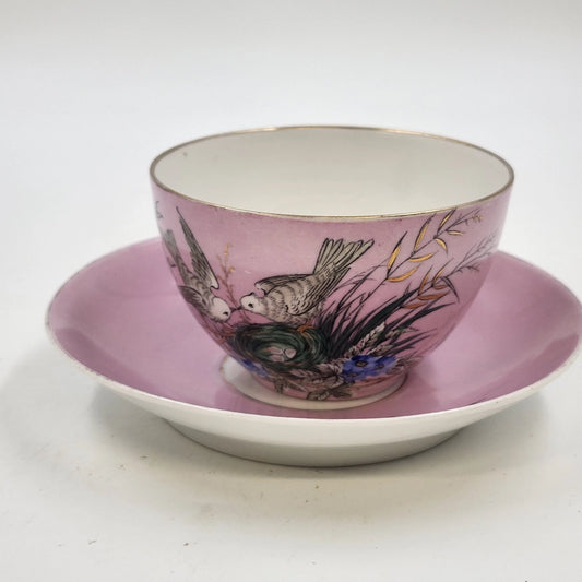 Vintage pink porcelain teacup and saucer with bird nest and blue flowers
