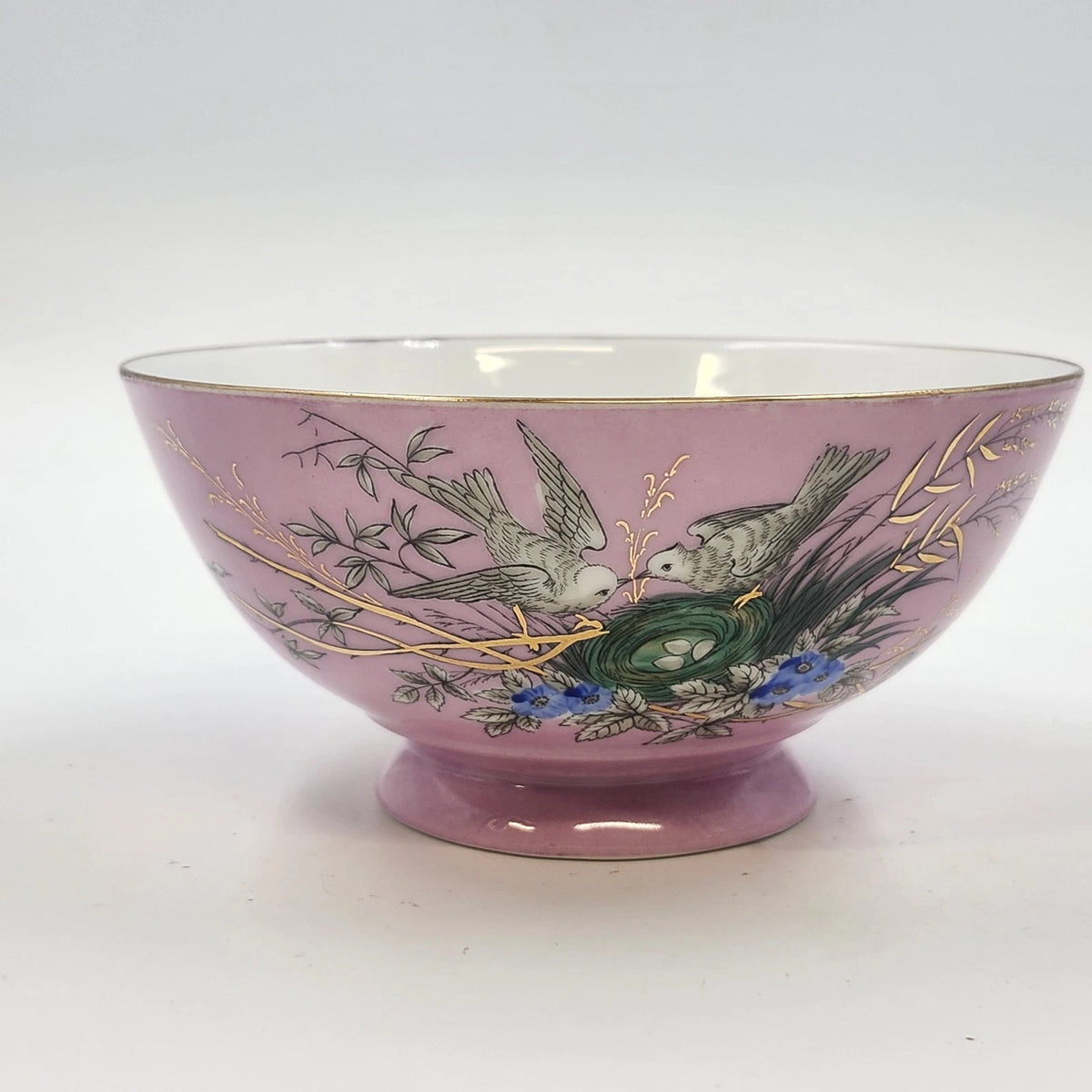 Vintage pink porcelain footed bowl with birds, nest, flowers, and gold trim