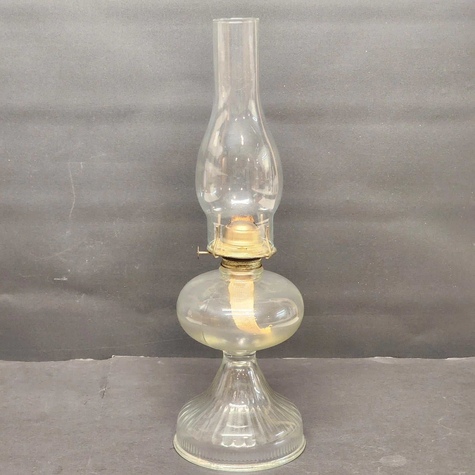 Vintage clear glass kerosene oil lamp with chimney
