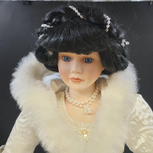 21 inch porcelain Victorian ice skater doll in white fur trimmed gown