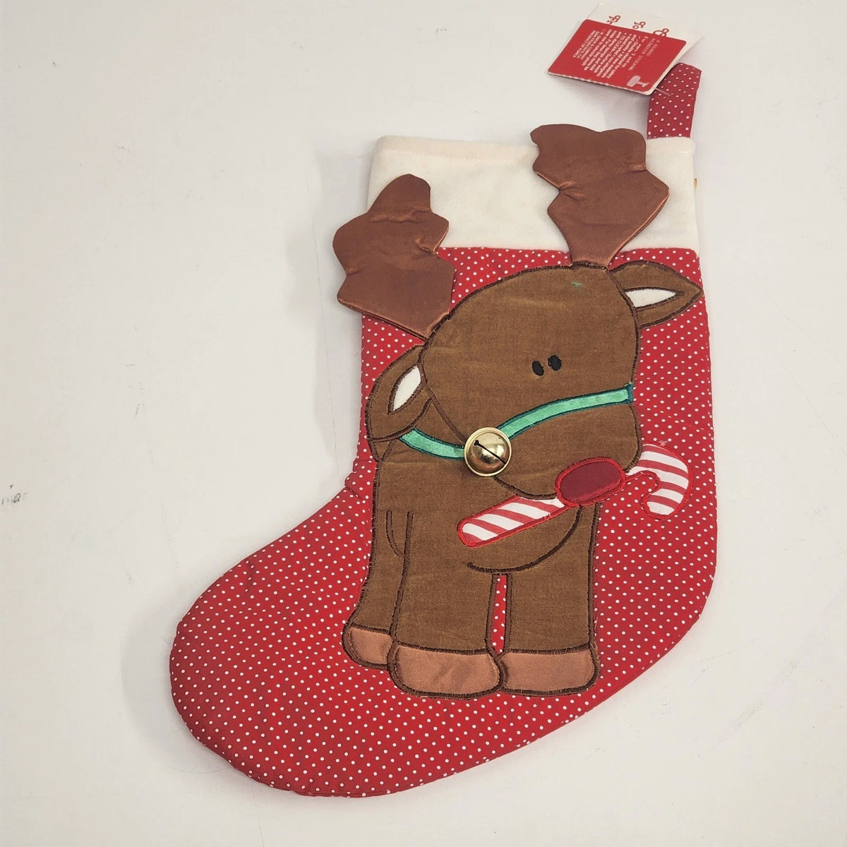 Vintage reindeer Christmas stocking with red nose and candy cane