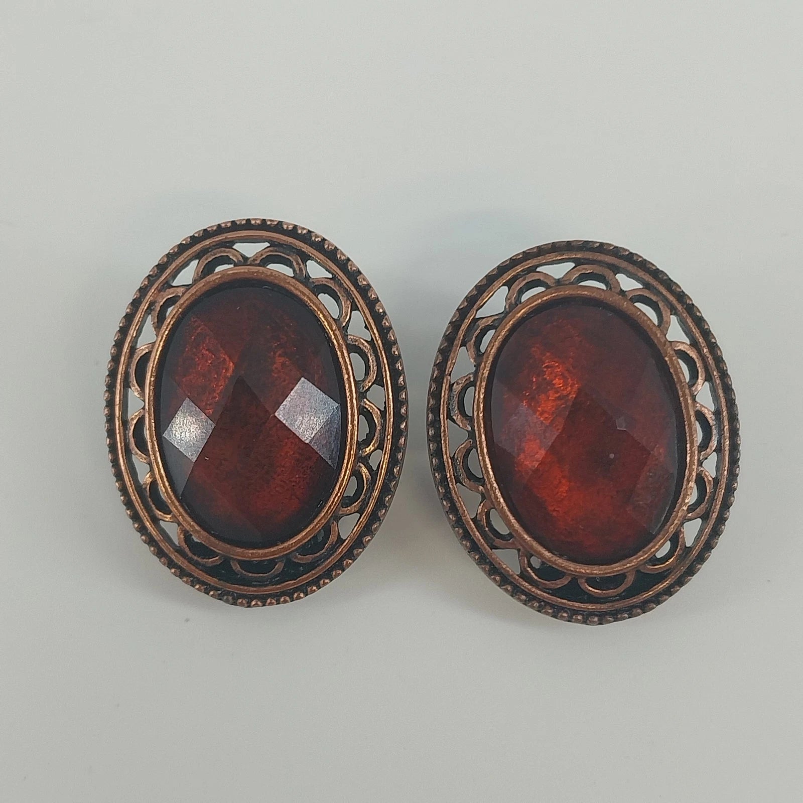 Vintage clip on earrings with root beer faceted stones and rhinestones