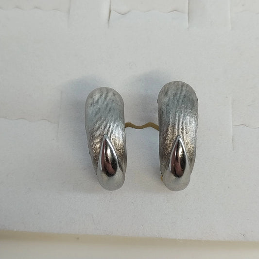 Vintage silver tone half hoop clip on earrings with textured brushed finish