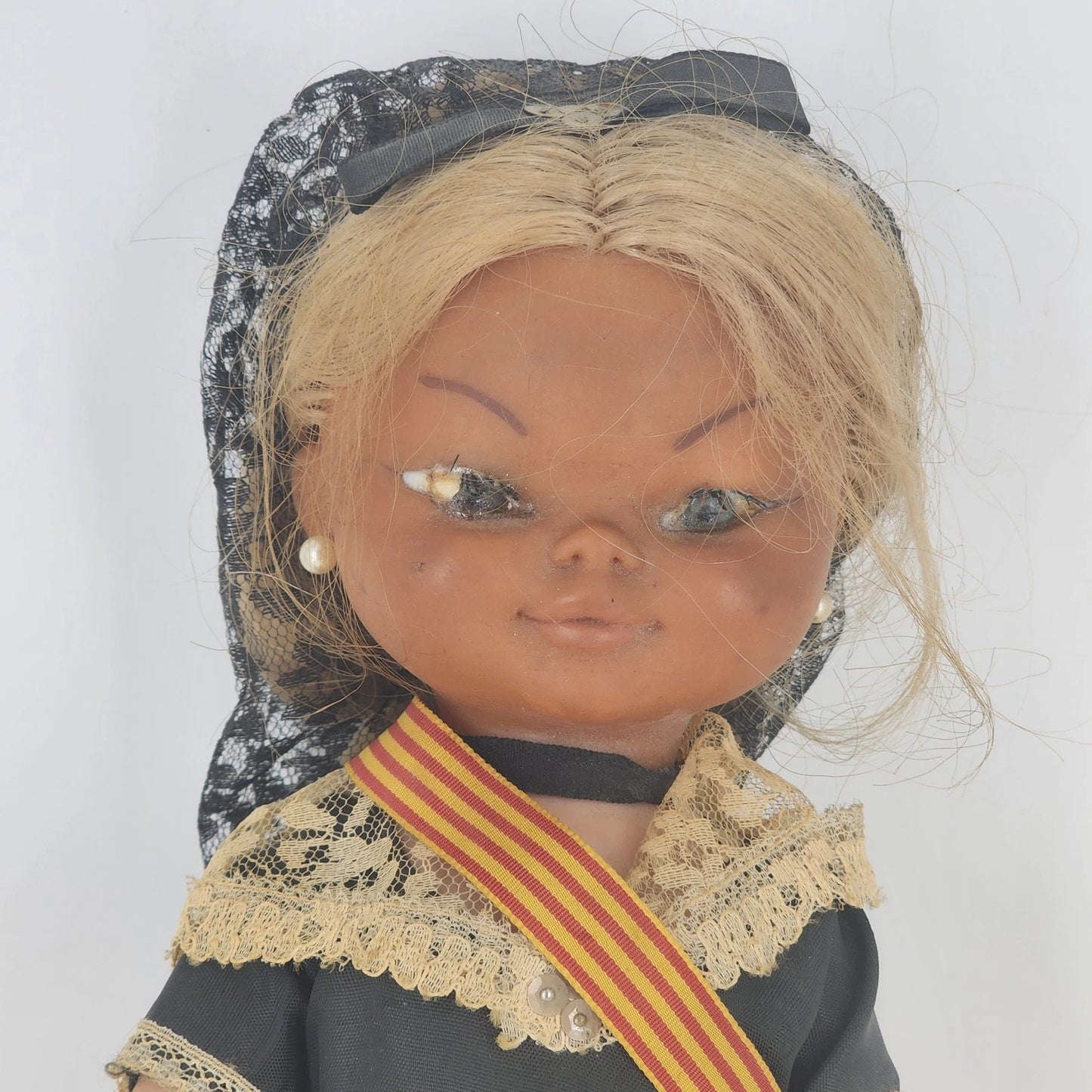 Vintage Spanish Catalonia souvenir doll wearing traditional mantilla and Senyera sash
