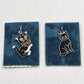 Pair of vintage black cat charms with green eyes and silver-tone details