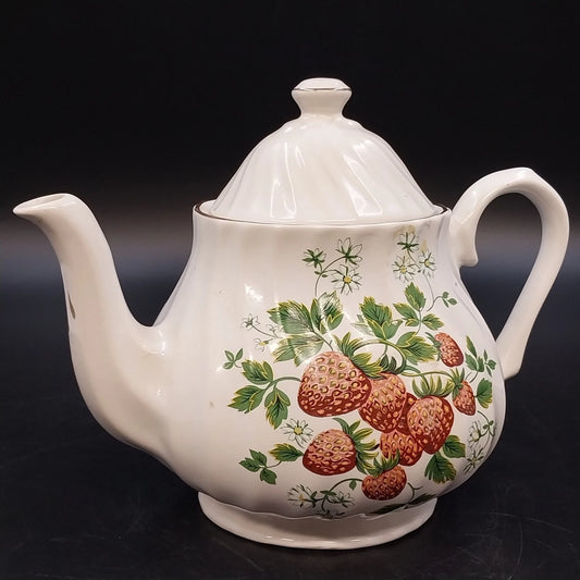 Vintage white ceramic teapot with strawberry floral design