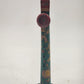 Vintage tin lithograph kazoo with colorful cartoon character graphics