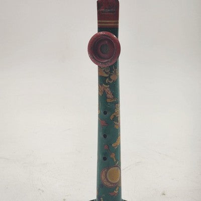 Vintage tin lithograph kazoo with colorful cartoon character graphics