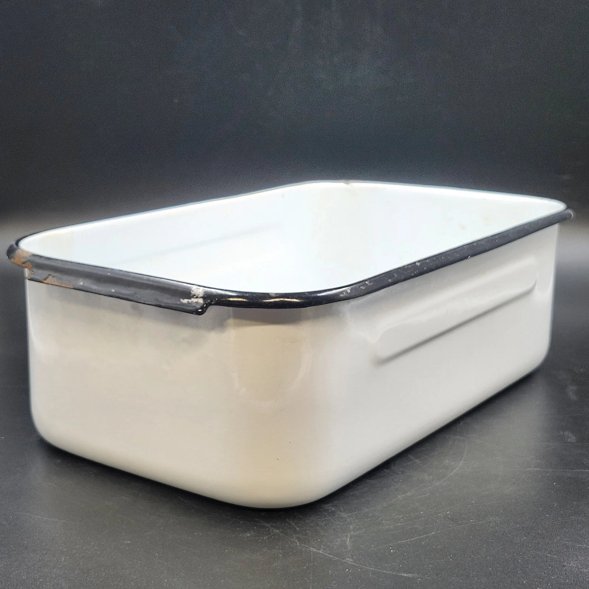 Vintage white enamelware roasting pan with black rim