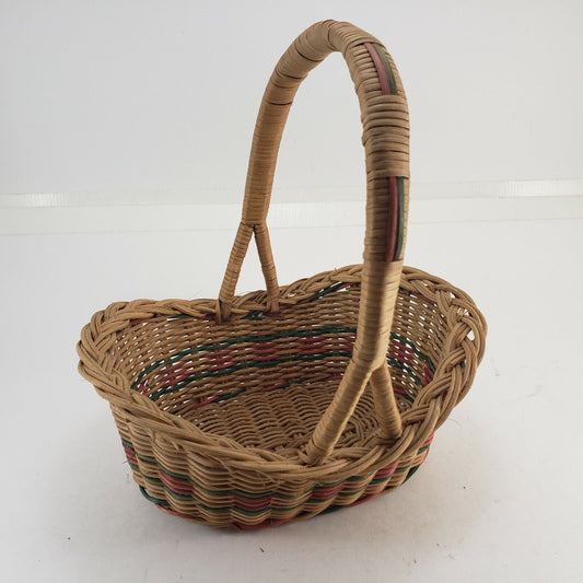Vintage oval wicker basket with handle in pink green and natural colors