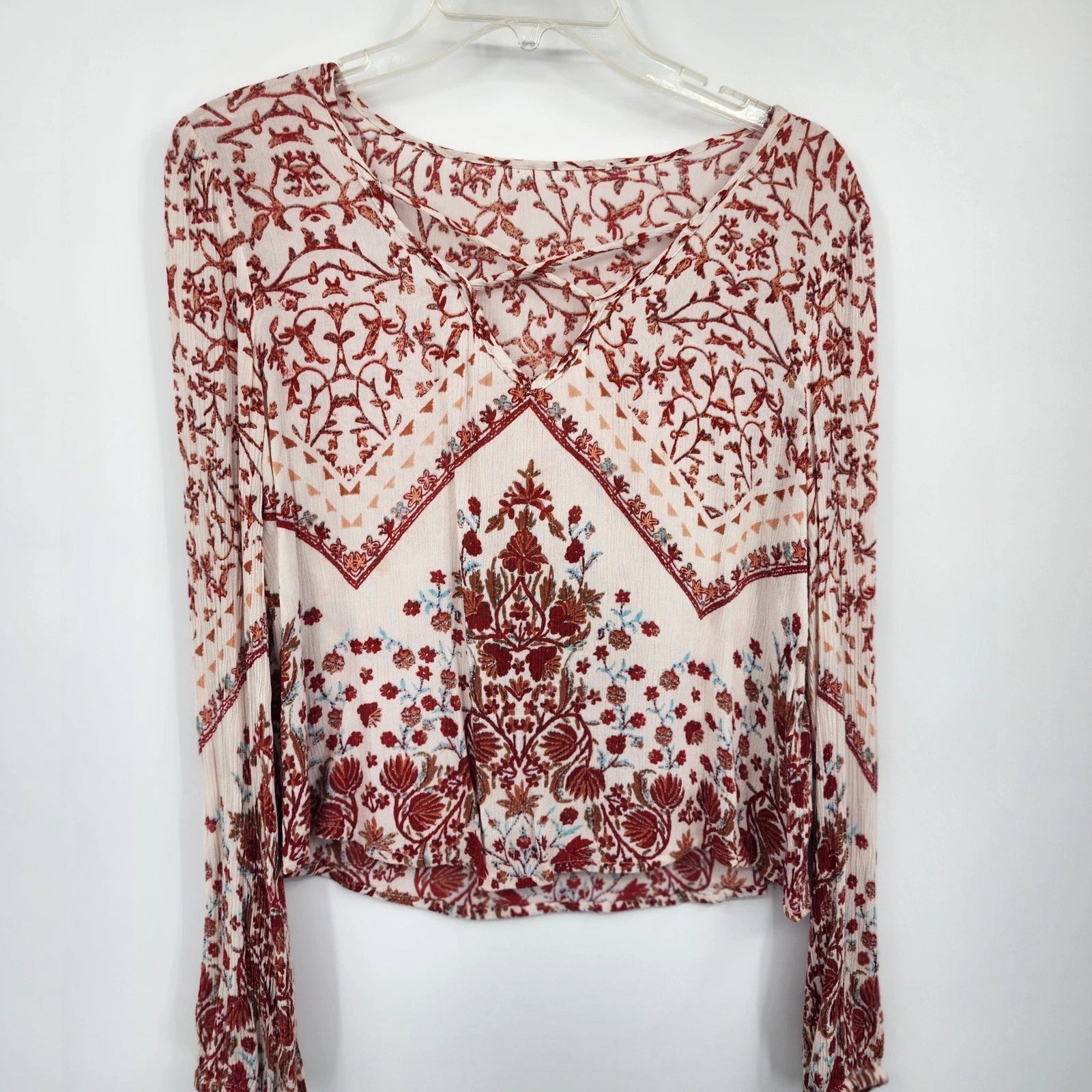 Women's white boho embroidered crop top with red and blue floral design