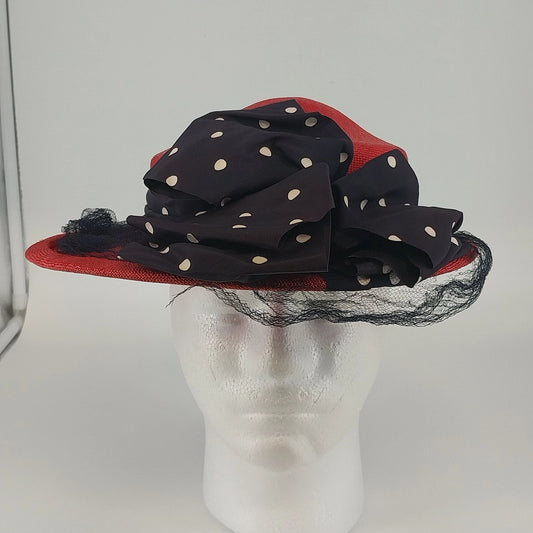 Women's red wide brim derby hat with polka dot bow