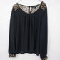 Black sheer XXI blouse with leopard print sleeve and shoulder accents