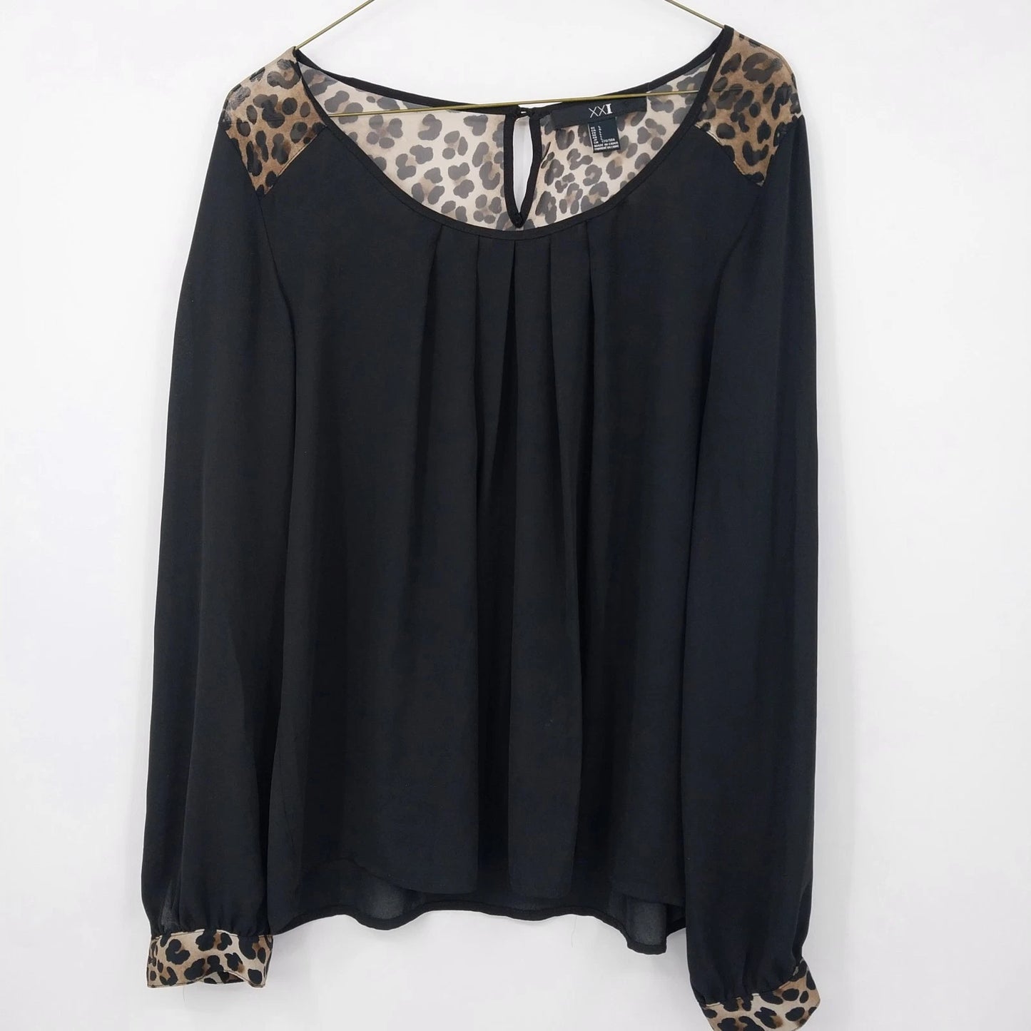 Black sheer XXI blouse with leopard print sleeve and shoulder accents