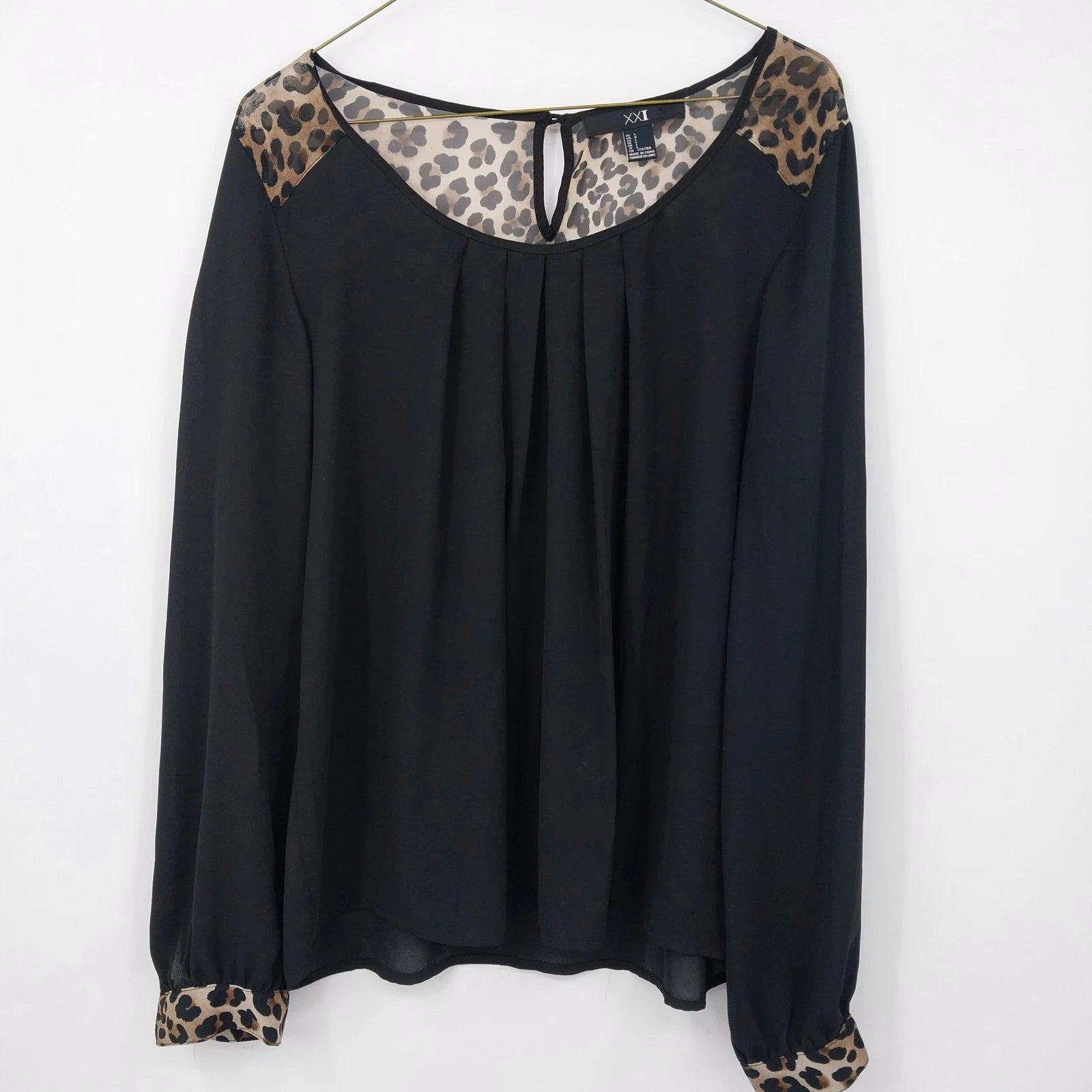 Black sheer XXI blouse with leopard print sleeve and shoulder accents