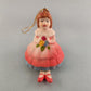 Young girl porcelain Christmas bell ornament with hanging leg chimes