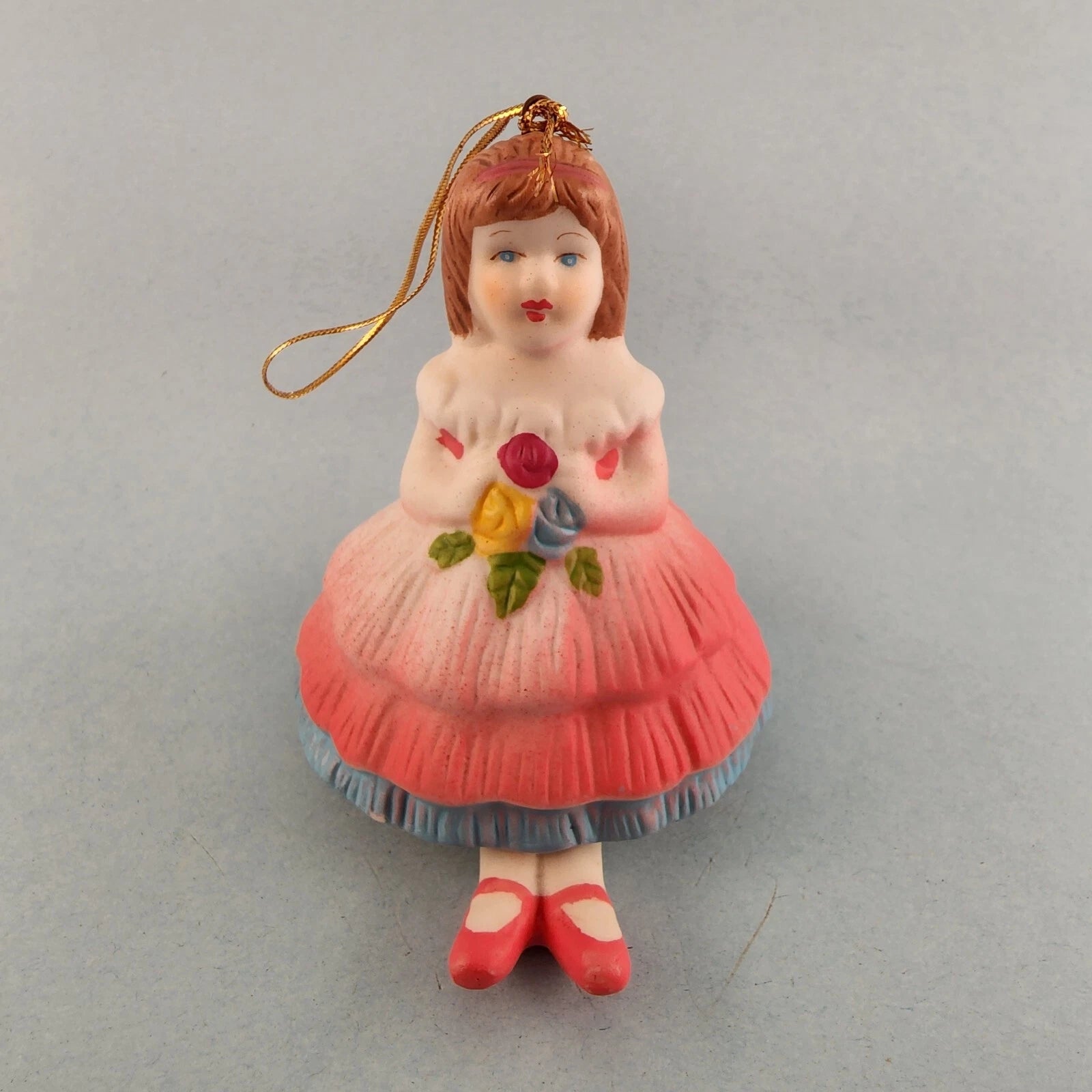 Young girl porcelain Christmas bell ornament with hanging leg chimes