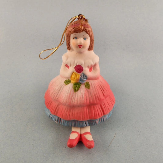 Young girl porcelain Christmas bell ornament with hanging leg chimes
