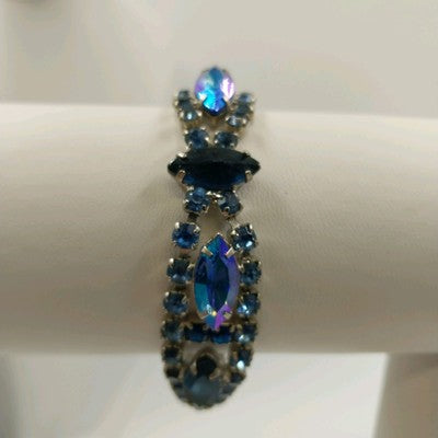Vintage 1960s Blue Rhinestone Bracelet – Silver Tone Metal with Faceted Oval & Round Stones – Black Enamel & Leaf Detail – 7" Open Box Clasp