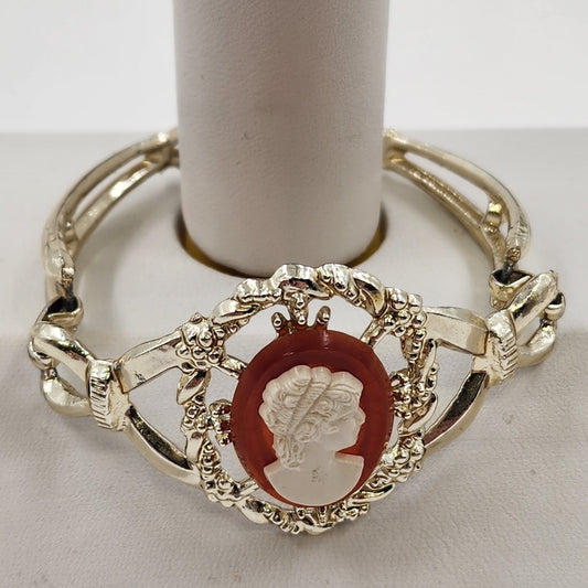 Gold Tone Hinged Bangle Bracelet with Red and White Lady Shell Cameo Charm 7"