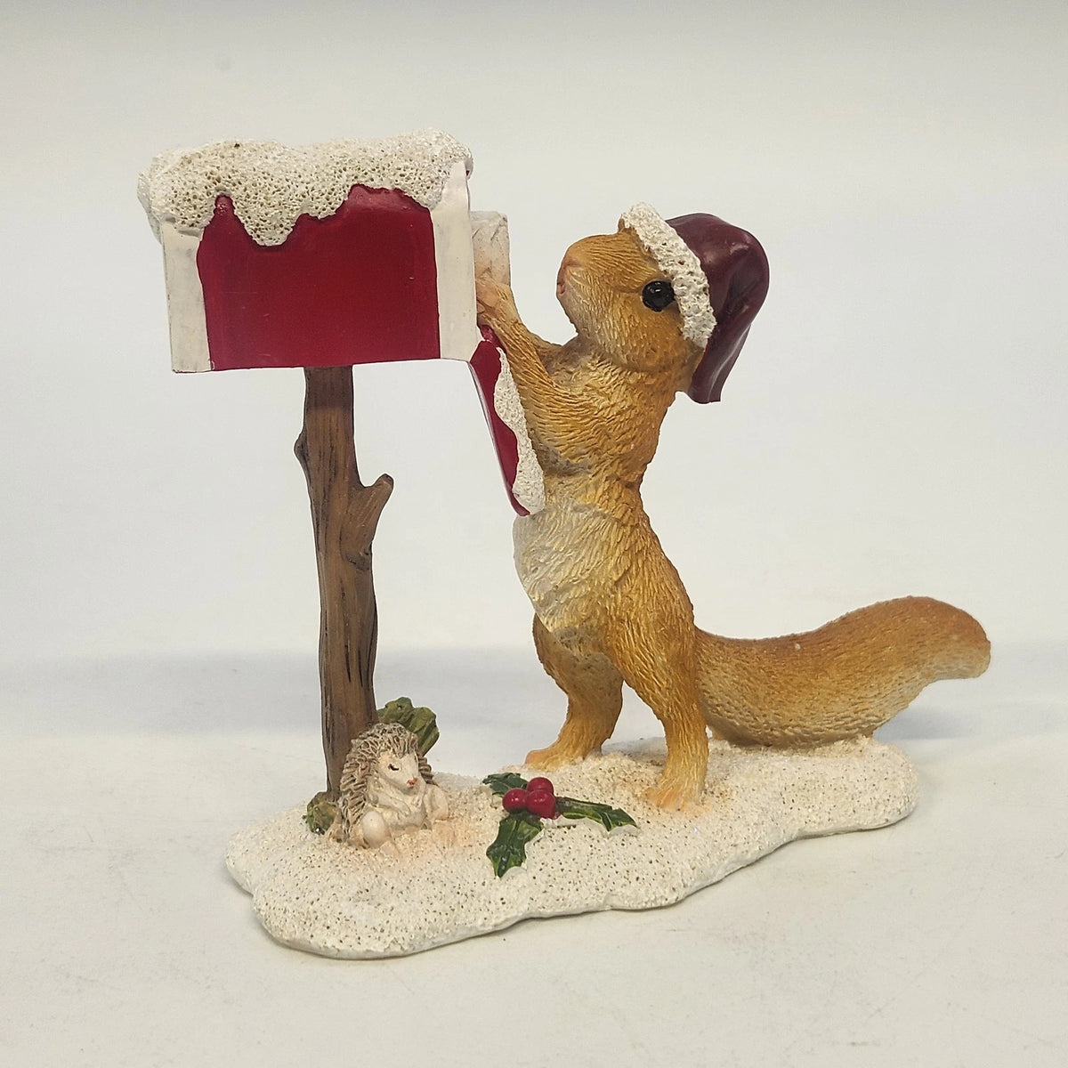 4.25-inch vintage Christmas squirrel figurine with Santa hat and mailbox