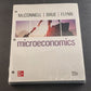 Microeconomics 22e ISE by Stanley Brue McGraw Hill Hole Punched For Binder NOS