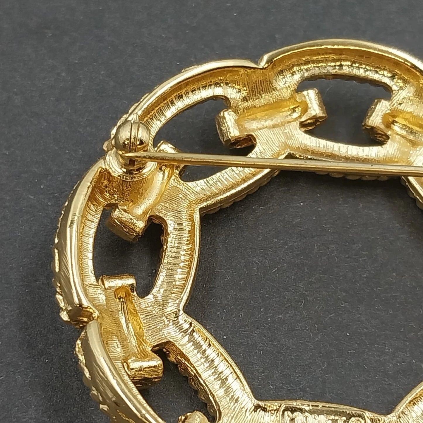 Monet Gold Tone Circle Brooch Interwoven Rope Chain Openwork Vintage