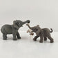 2 Miniature Gray Elephants One Swinging a White Bunny from it's Trunk 3.5" Long