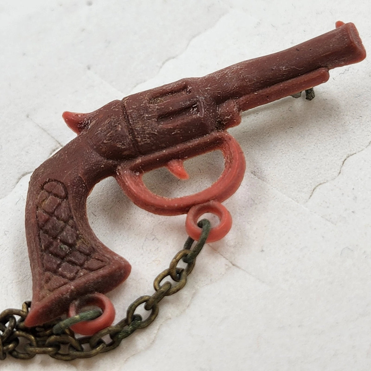 Title: Western Revolver Pistol Brooch Pin Red Miniature Gun Chain Novelty Vtg