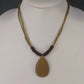 Linea Pele Brushed Gold Teardrop Pendant Necklace With Multi Strand Brown Cord
