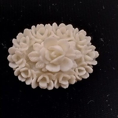 White Molded Celluloid Plastic Carved Style Brooch 1" Oval Flower Design