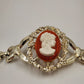 Gold Tone Hinged Bangle Bracelet with Red and White Lady Shell Cameo Charm 7"