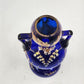 Art Nouveau Bohemian Cobalt Blue Glass Vase with Heavy Gold Gilding – 8" Tall – Dual Handles & Globe Top – Vintage European Display Piece