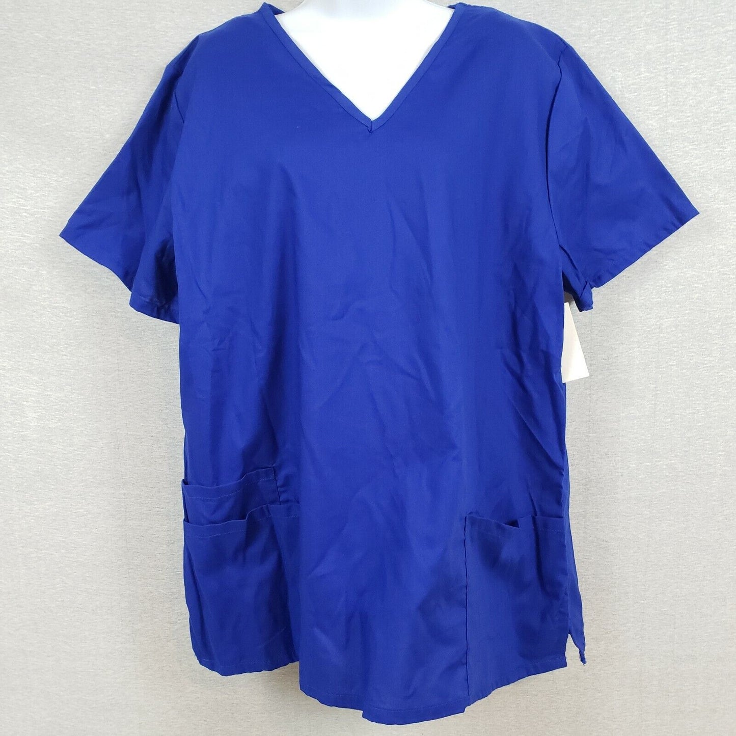 Solid blue womens scrub top with pockets and side slits by B Scrubs