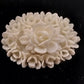 White Molded Celluloid Plastic Carved Style Brooch 1" Oval Flower Design