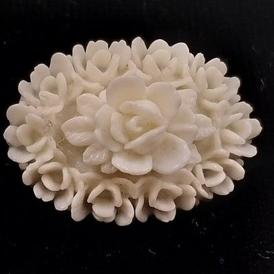White Molded Celluloid Plastic Carved Style Brooch 1" Oval Flower Design