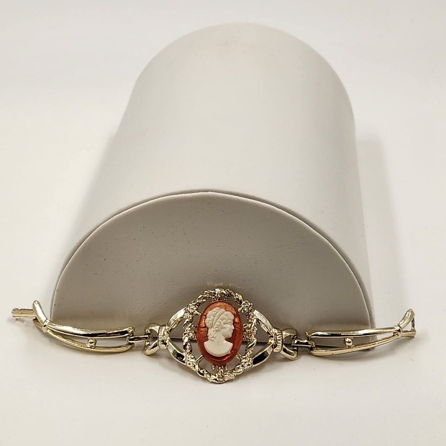 Gold Tone Hinged Bangle Bracelet with Red and White Lady Shell Cameo Charm 7"